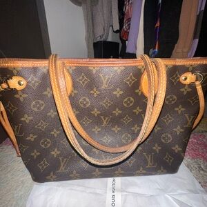 Louis Vuitton never full ( used but still great condition)